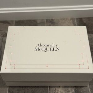 Alexander McQueen’s black and white sneakers.